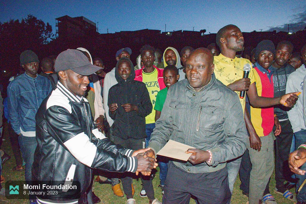 A prize handed over at dusk as the tournament closes