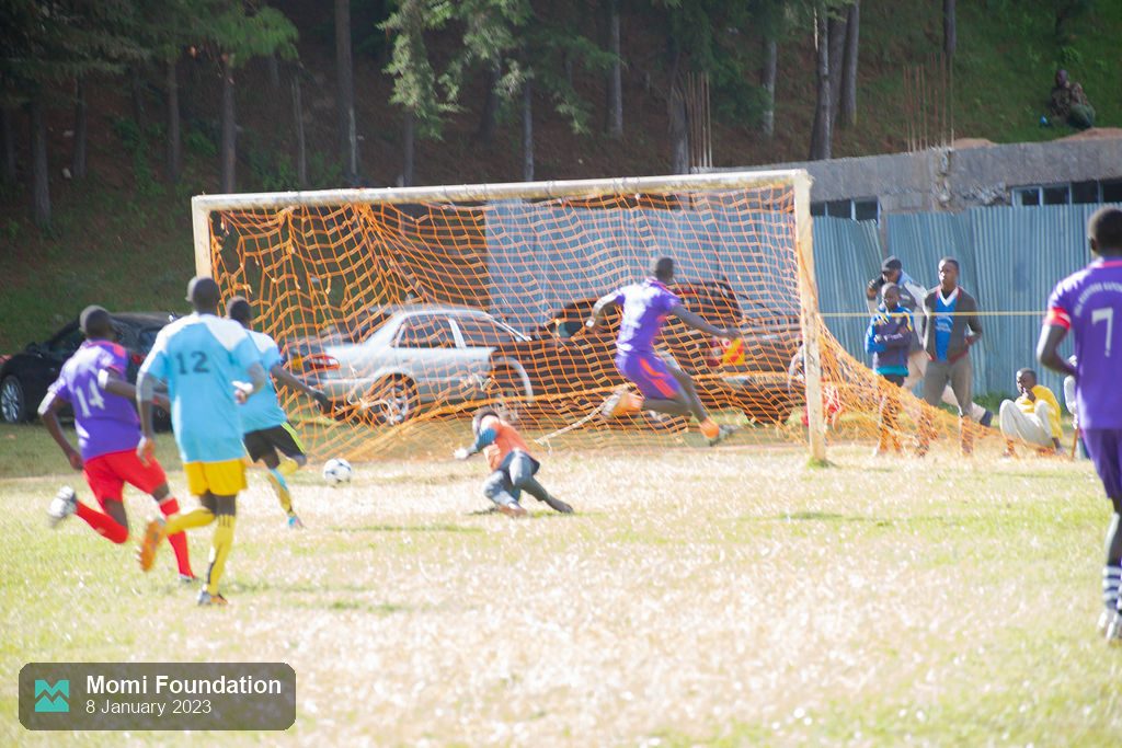 The ball hits the back of the net