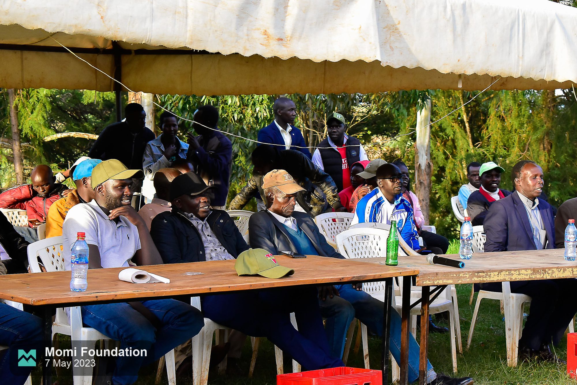 Guests seated at the high table under a tent