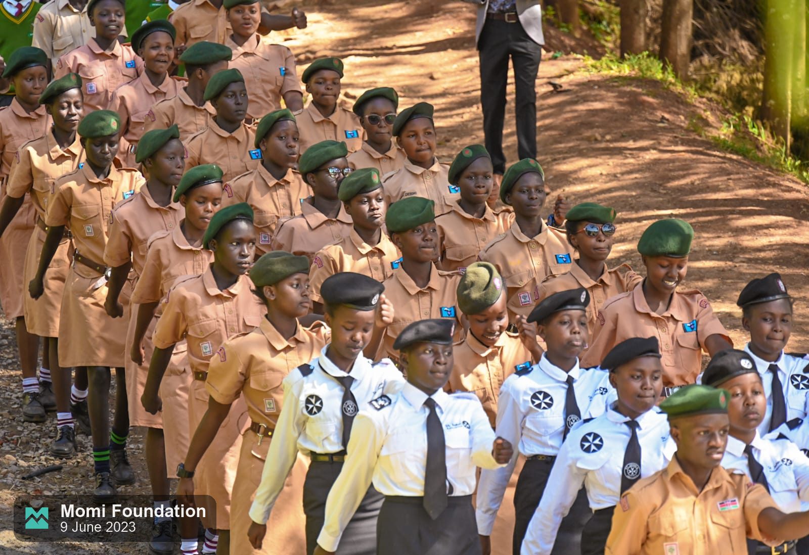 Scouts and pupils in uniform on parade