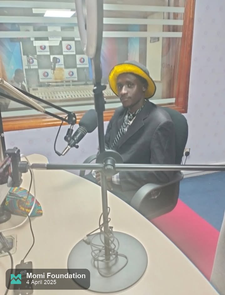 Director D at the microphone in the Radio Citizen studio